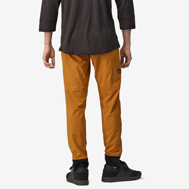 Patagonia Men's Dirt Craft Pants, golden caramel, back view on model.