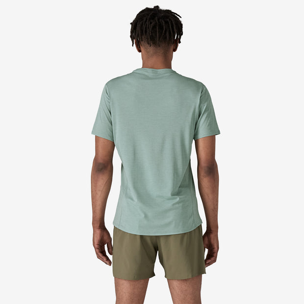 Patagonia Men's Short-Sleeve Capilene Cool Lightweight Shirt, light blue X-dye, back view on model.