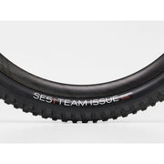 Bontrager SE5 Team Issue 27.5x2.50 TLR Black Mountain Bike Tire, side view.