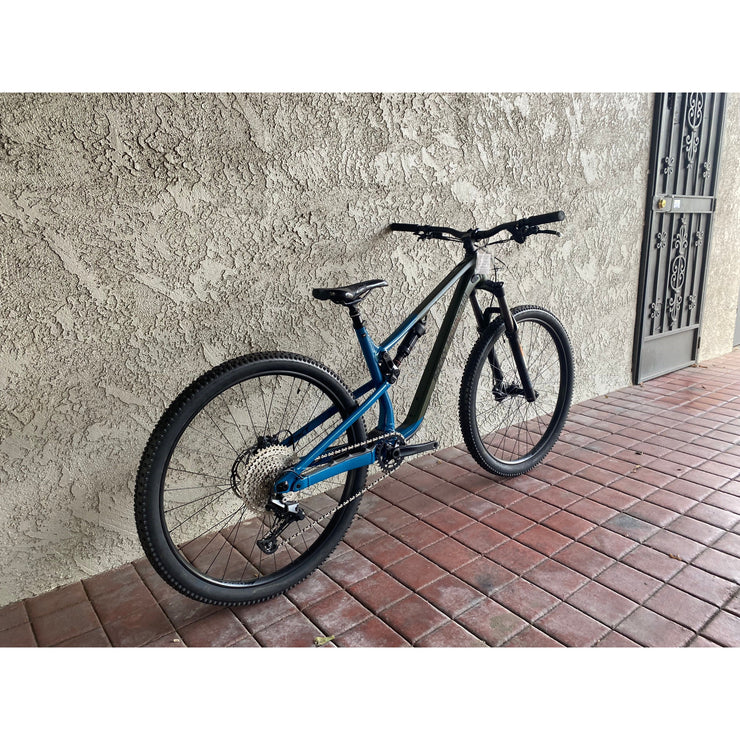 2022 Rocky Mountain Instinct A10, blue/green, *BLEM*, rear wheel view.