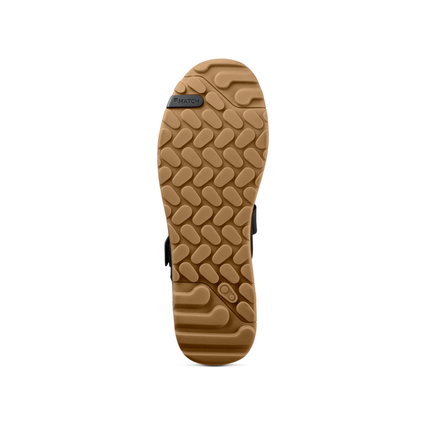 Crankbrothers Stamp Trail BOA Flat Shoes in black/ gold/ gum, bottom view.