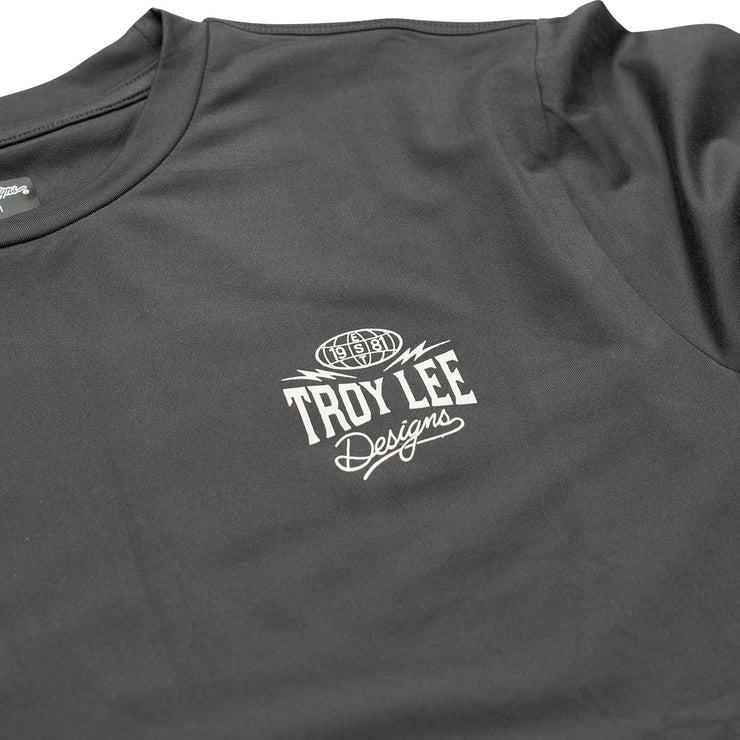 Troy Lee Designs Ruckus Long Sleeve Ride Tee, bolts carbon, logo view.