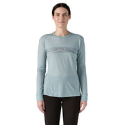 Patagonia Women's Long Sleeve Capilene Cool Merino Blend Graphic Shirt, in Strata Stripe: Thermal Blue, front view on model.