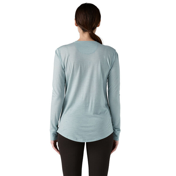 Patagonia Women's Long Sleeve Capilene Cool Merino Blend Graphic Shirt, in Strata Stripe: Thermal Blue, back view on model.